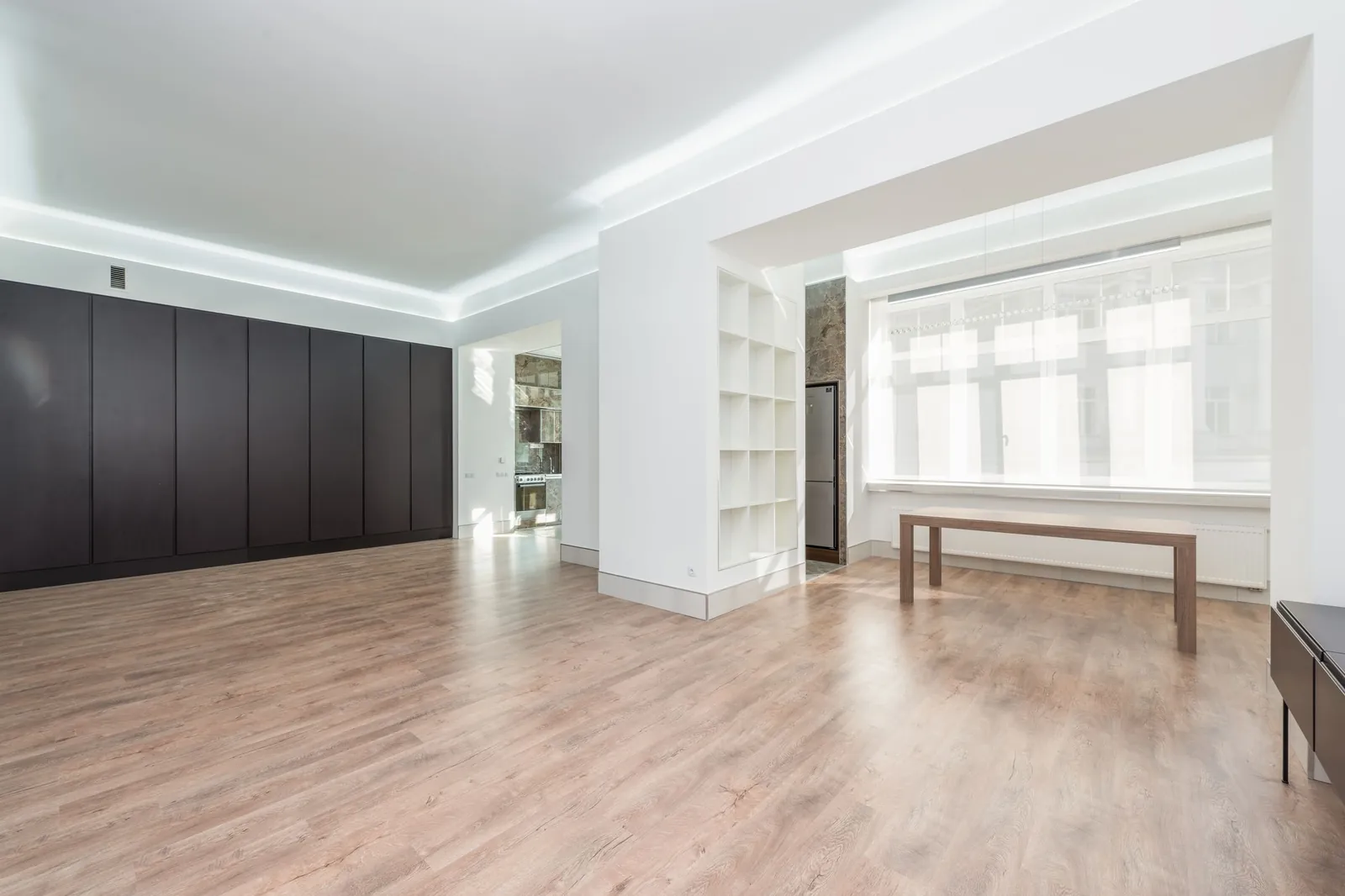 A restored room with clean painted walls and wood flooring